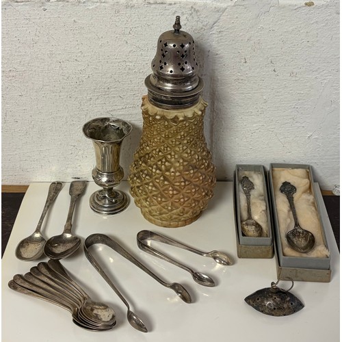 60 - A small quantity of silver items, various dates and makers, to include a silver mounted caster, two ... 