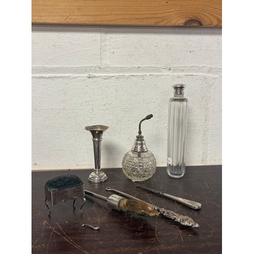 5 - A mixed lot of silver mounted items, various dates and makers to include bud vase, atomiser, pin cus... 