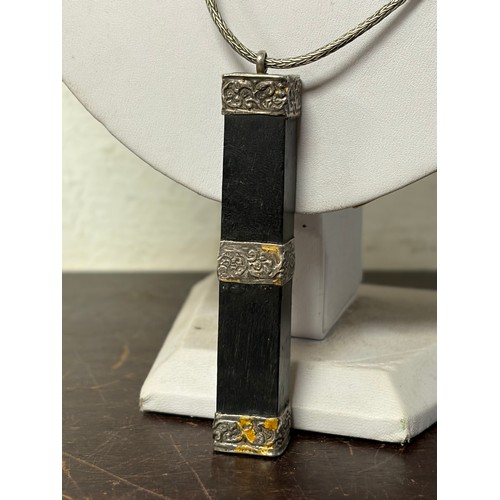 8 - An Eastern seal pendant, with white metal mounts, to chain -