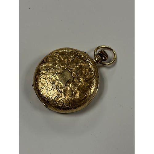 6 - An 18ct gold open face lady's fob watch, with engraved decoration to dial -
