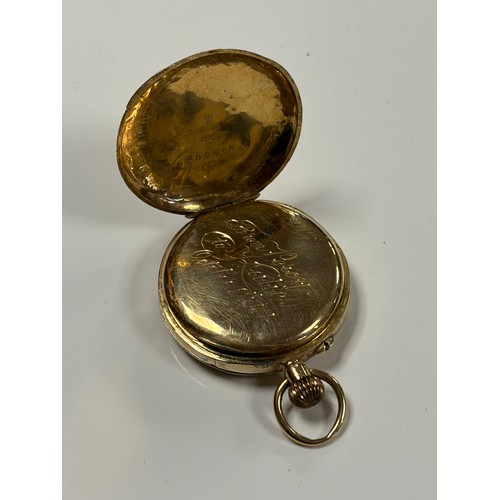 6 - An 18ct gold open face lady's fob watch, with engraved decoration to dial -