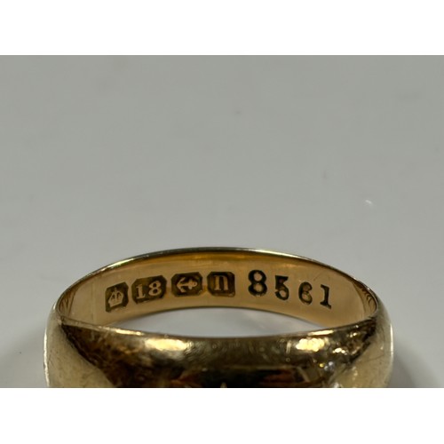 3 - An 18ct gold ring, gipsy set with three single cut diamonds -
