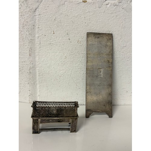19 - A Chinese white metal model of a sofa and a scroll weight in the form of a screen panel -