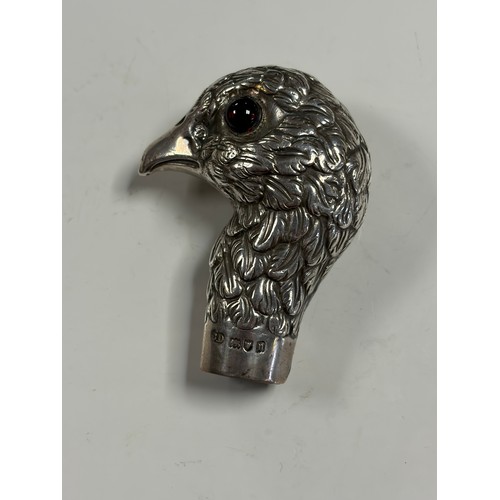 29 - An Edwardian silver umbrella/parasol handle, London 1908 and signed Brigg in the form of a bird's he... 