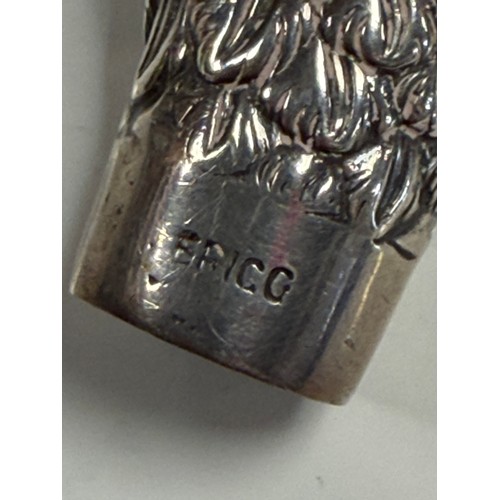 29 - An Edwardian silver umbrella/parasol handle, London 1908 and signed Brigg in the form of a bird's he... 