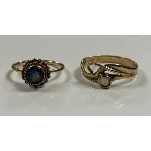 32 - An Art Nouveau style 9ct gold ring, set with an opal and another opal ring (2) -