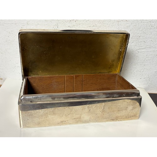 60 - A George V silver cigarette box, Birmingham 1921, with lined base -