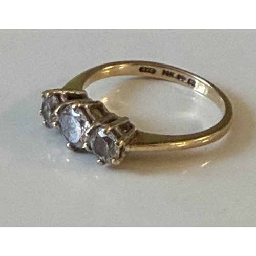 10 - A CZ three stone ring, set in 14ct gold -