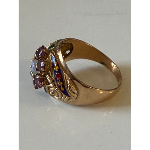 28 - A continental dress ring, set with an opal and garnet cluster with enamel highlights, stamped 14 -