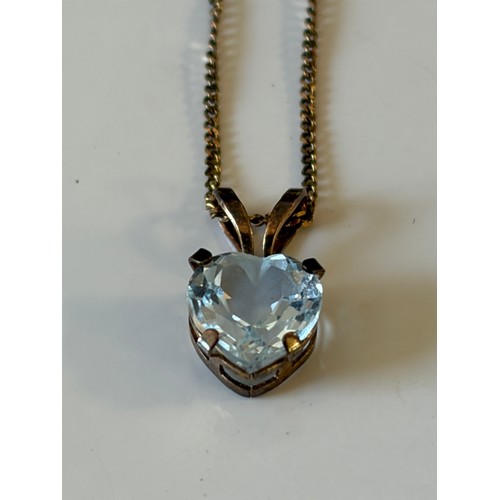 45 - A 9ct gold mounted blue topaz pendant, of heart shape, to fine chain -