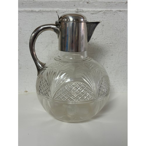47 - A late Victorian silver claret jug, London 1898, with hinged cover and cut glass body -