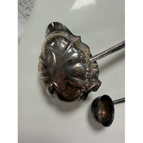 48 - A George IV silver toddy ladle, London 1821, with shaped bowl and ebony handle and another smaller e... 
