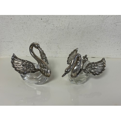 53 - A pair of Italian silver and cut glass salts, each of swan design, stamped 925, with silver head and... 