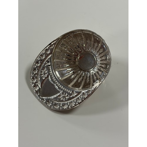 56 - An Elizabeth II silver caddy spoon, Sheffield 1964, of jockey cap design -