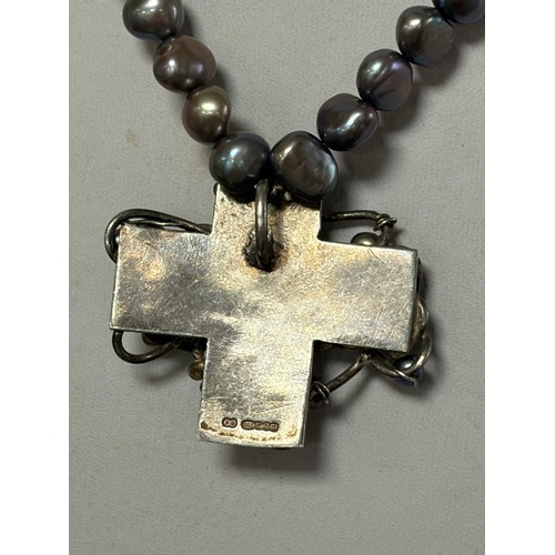 59 - A silver freshwater pearl necklace, the grey tone pearls suspending a silver and pearl cross pendant... 