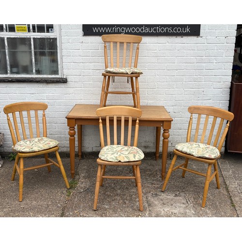 An oak topped table, together with four bar back chairs -