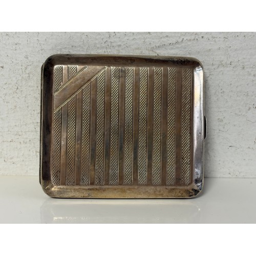 A George V silver cigarette case, Birmingham 1928, with inscription -