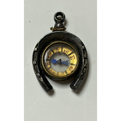 13 - A silver mounted fob compass, in the form of a horseshoe -