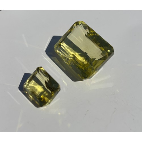 15 - A large rectangular step cut citrine, and a smaller example -