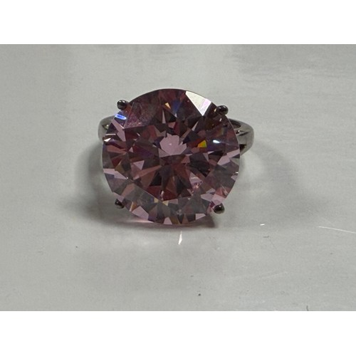 24 - A modern silver dress ring, set with a large pink CZ -