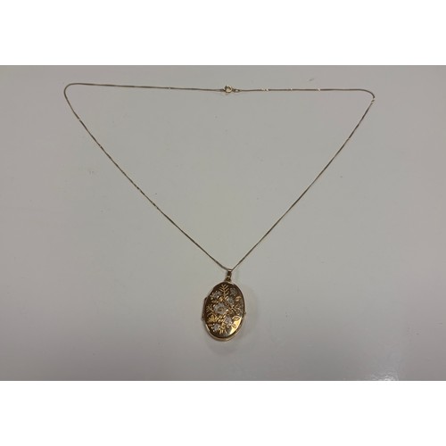 33 - A 9ct gold locket on chain -