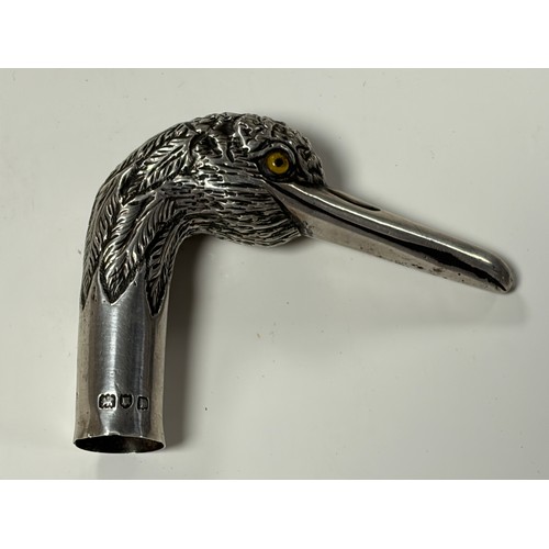 37 - An Edwardian silver cane/parasol handle, London 1907/1908, designed as a heron's head -