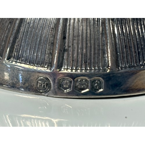 38 - A Queen Elizabeth II silver caddy spoon, Sheffield 1972, in the form of a jockey's cap -