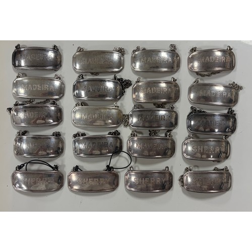 47 - A collection of silver plated decanter labels -