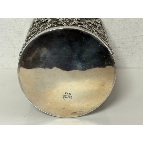 49 - A Siam silver cylindrical jar and cover, stamped Sterling 925, with repousse decoration, lined inter... 