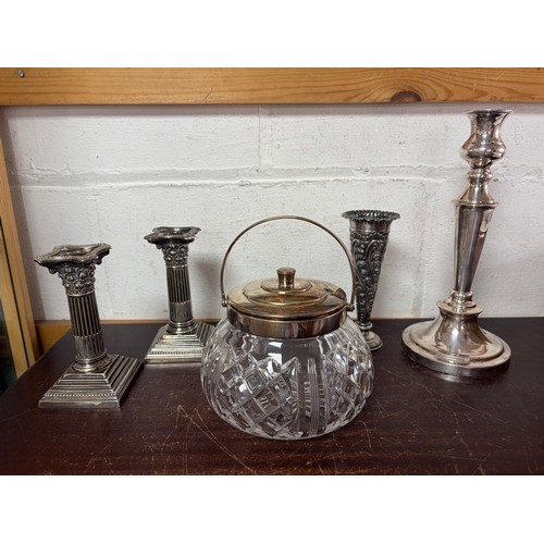 50 - A pair of silver plated candlesticks, together with a Hukin and Heath mounted biscuit barrel, a bud ... 