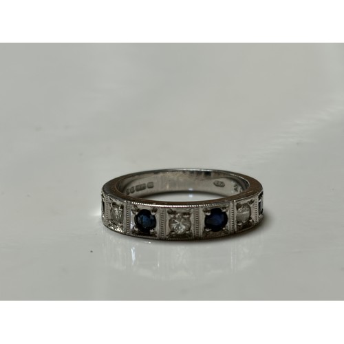 57 - A sapphire and diamond half eternity ring, set in 18ct white gold with alternating circular sapphire... 