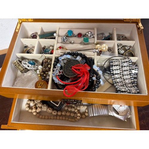 60 - A jewellery box and contents -