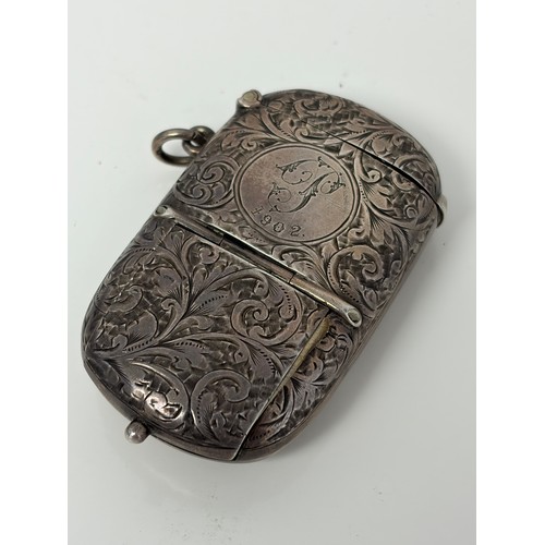 5 - A late Victorian silver combination sovereign holder/vesta/stamp case, Chester 1899, with later pres... 