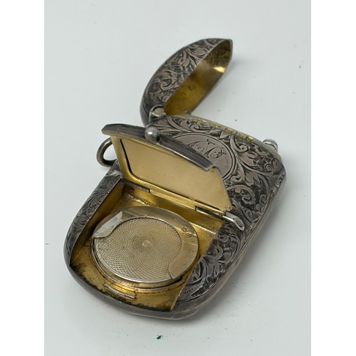 5 - A late Victorian silver combination sovereign holder/vesta/stamp case, Chester 1899, with later pres... 