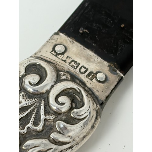7 - An Edwardian silver handled paper knife/page turner, London 1904, with tortoiseshell turner -