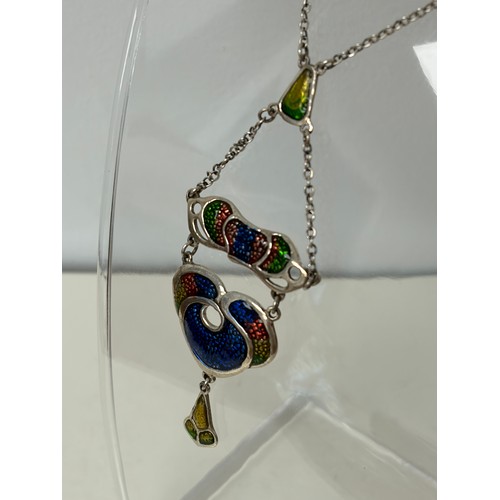 38 - A modern silver and enamel pendant necklace, in the style of Charles Horner -