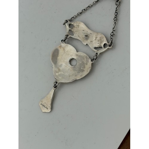 38 - A modern silver and enamel pendant necklace, in the style of Charles Horner -
