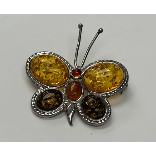 48 - A silver and amber set butterfly brooch -