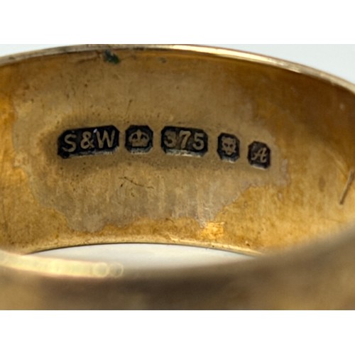 2 - A 9ct gold wedding band, with engraved decoration -