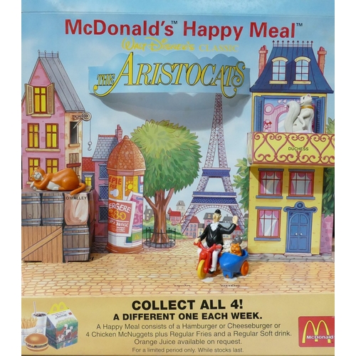 804 - A  collection of  McDonald happy meal kid club toys and boxes to include:  Aristocats