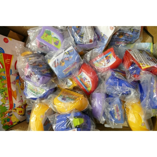 810 - A  collection of  McDonald happy meal kid club toys and boxes to include:  Racers together with a sh... 