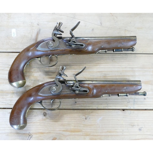 1066 - Pair of early copies of Flintlock Duelling Type Pistols: brass barrels, Ketland on locks