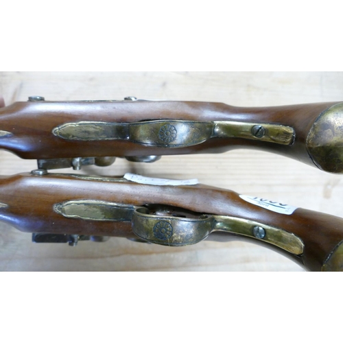 1066 - Pair of early copies of Flintlock Duelling Type Pistols: brass barrels, Ketland on locks