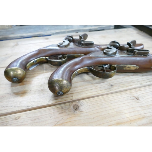 1066 - Pair of early copies of Flintlock Duelling Type Pistols: brass barrels, Ketland on locks