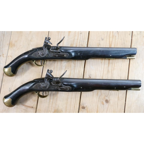 1067 - 20th Century Pair of Britishl long Sea service 
 Pistols: belt hooks on reverse, ordinance stamps on... 