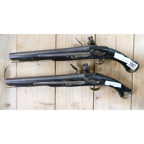 1067 - 20th Century Pair of Britishl long Sea service 
 Pistols: belt hooks on reverse, ordinance stamps on... 