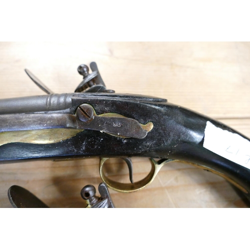 1067 - 20th Century Pair of Britishl long Sea service 
 Pistols: belt hooks on reverse, ordinance stamps on... 