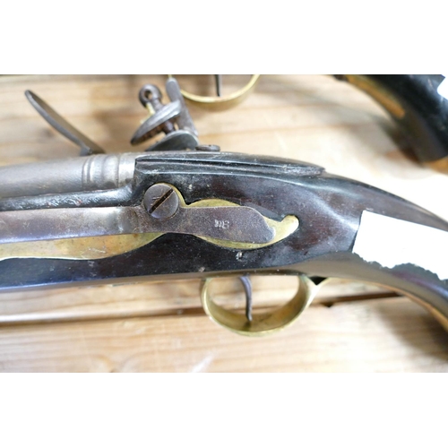 1067 - 20th Century Pair of Britishl long Sea service 
 Pistols: belt hooks on reverse, ordinance stamps on... 