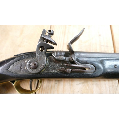 1067 - 20th Century Pair of Britishl long Sea service 
 Pistols: belt hooks on reverse, ordinance stamps on... 