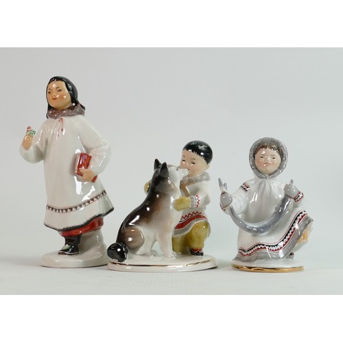 654 - Russian Lomonosov pottery figures of Eskimos: Height of tallest 19cm. (3)